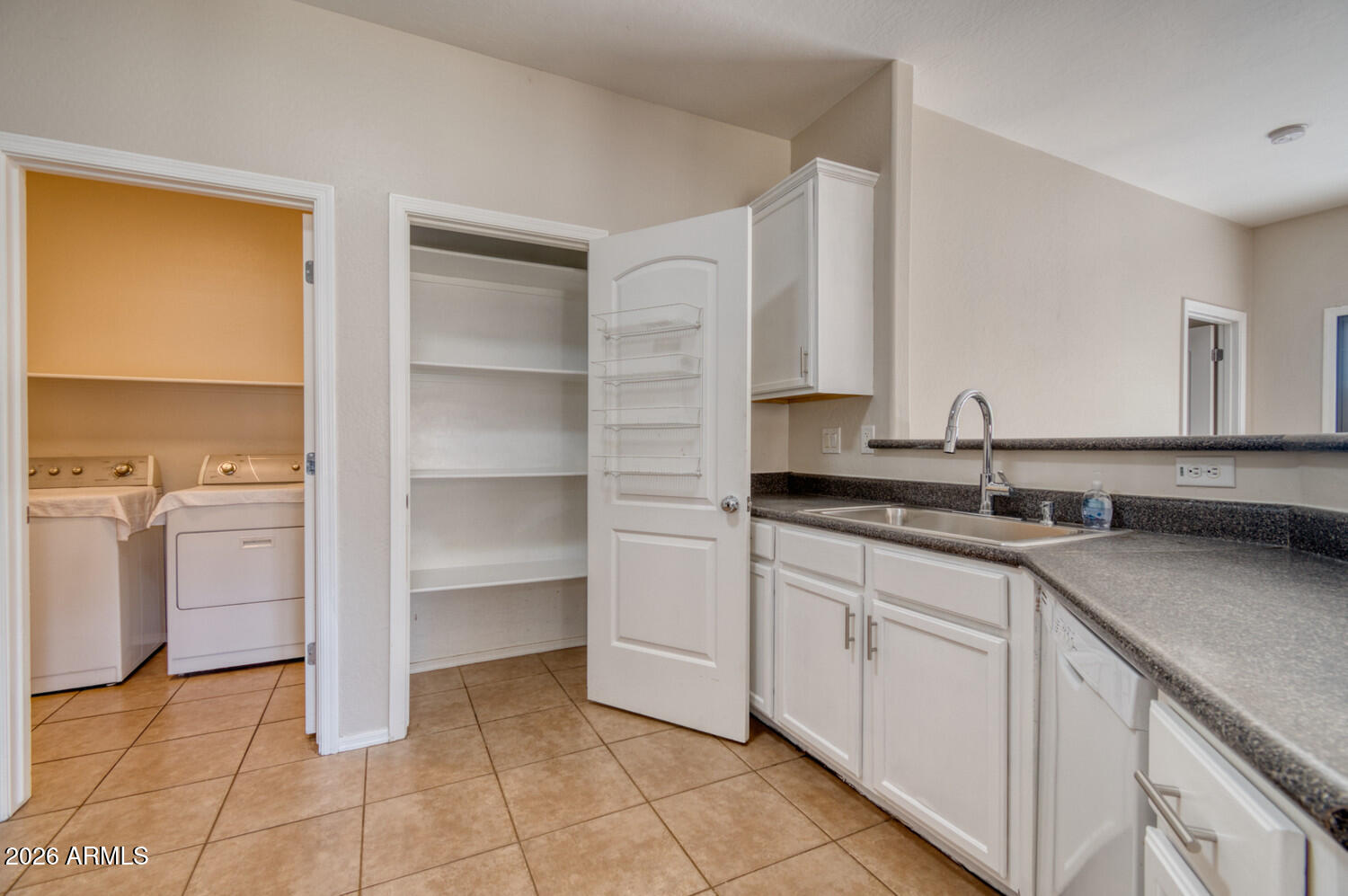2565 South Signal Butte Road, Unit 46 Mesa, AZ 85209 - Photo 17 of 41 a kitchen with a sink and cabinets