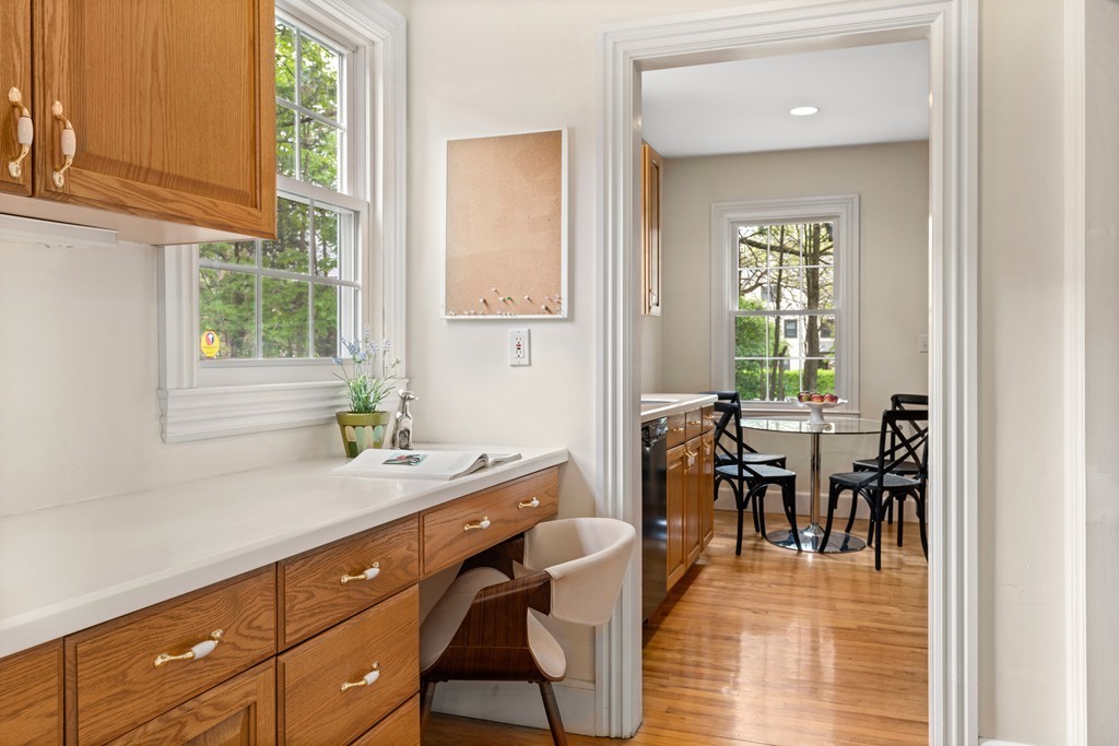 8-10 Upland Road Wellesley, MA 02482 - Photo 16 of 24 a view of a dining room with furniture and windows