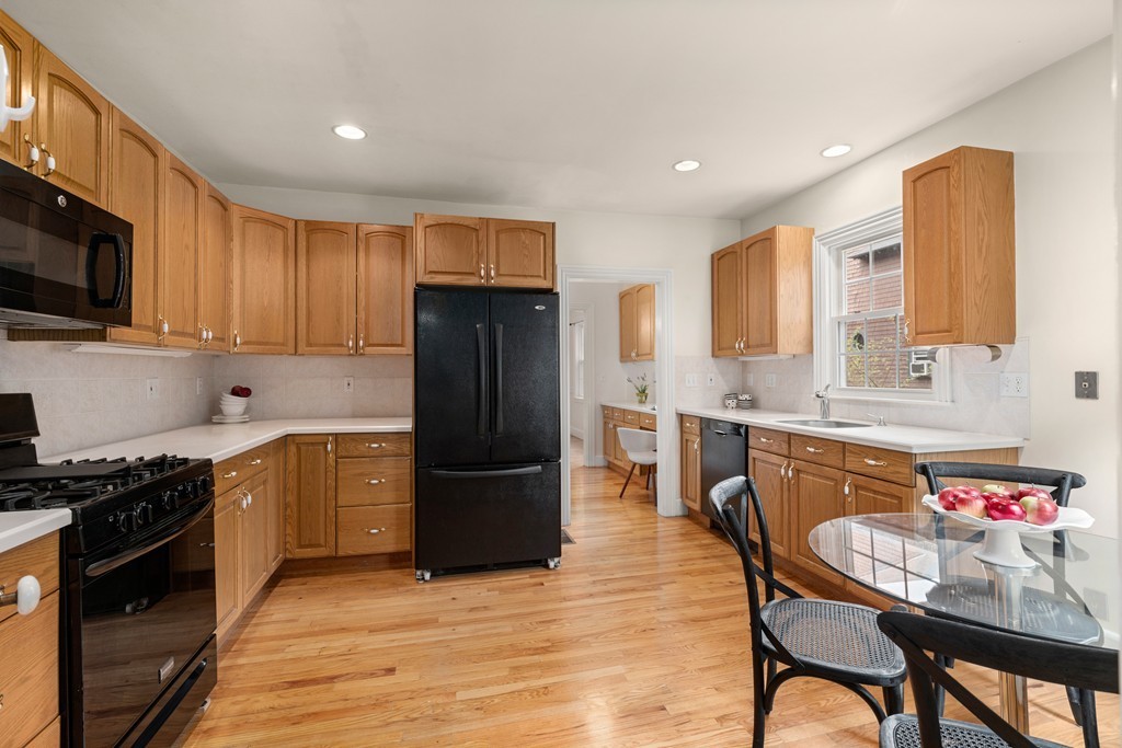 8-10 Upland Road Wellesley, MA 02482 - Photo 18 of 24 a kitchen with granite countertop a refrigerator stove top oven and sink