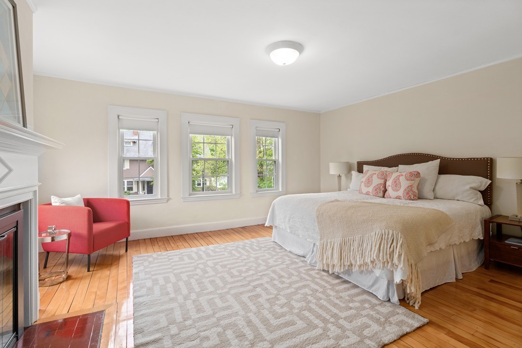 8-10 Upland Road Wellesley, MA 02482 - Photo 20 of 24 a bedroom with a bed and a couch