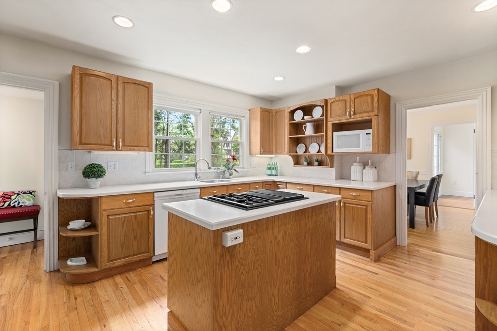 8-10 Upland Road Wellesley, MA 02482 - Photo 7 of 24 a kitchen with stainless steel appliances granite countertop a stove a sink dishwasher and a refrigerator