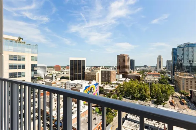a view of a city from a balcony with city view