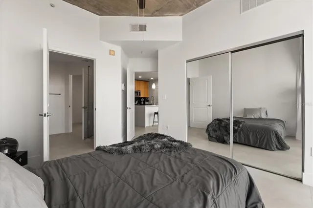 a bedroom with a bed and a walk in closet