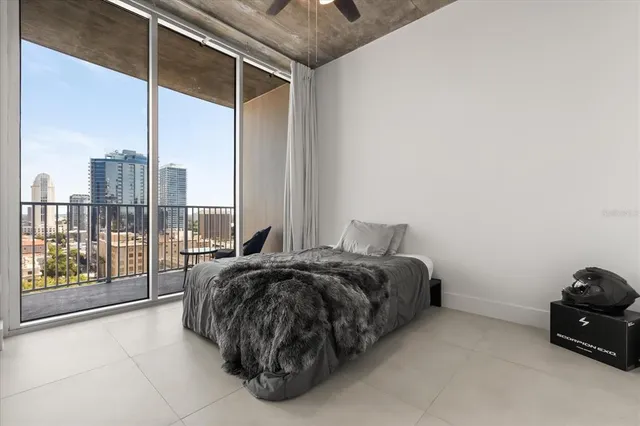 a bed sitting in a room next to a window