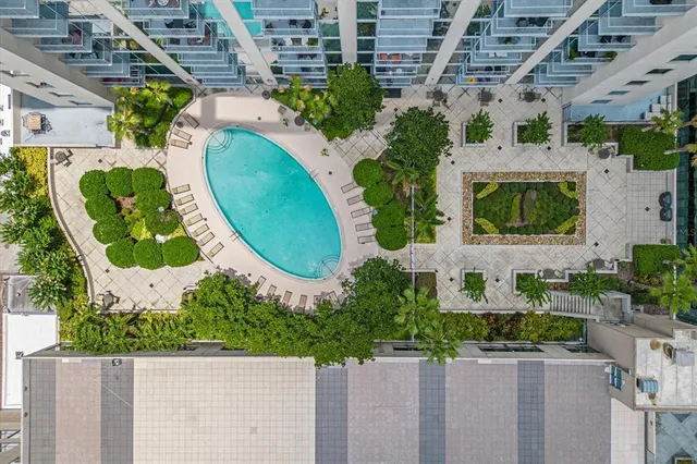 an aerial view of a house with a swimming pool