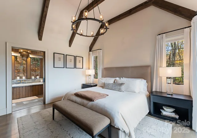 a bedroom with a large bed and a window