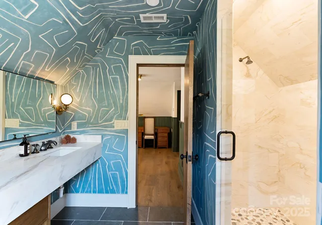 a bathroom with a sink and a mirror