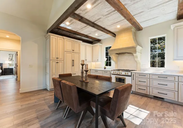 a view of a dining room with furniture and window