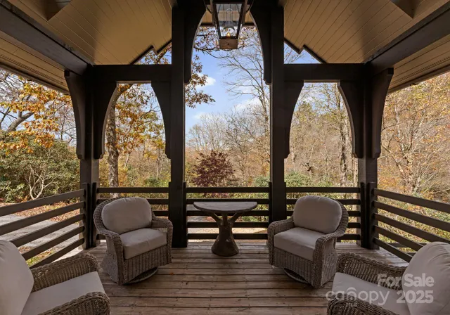 a bedroom with a large bed and a lamp on dresser