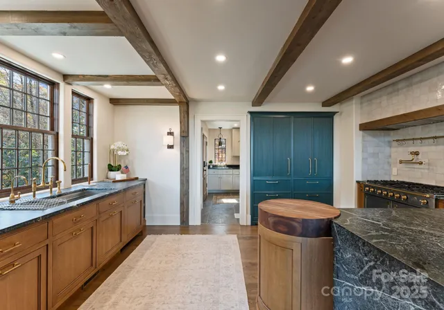a bathroom with a sink a large mirror and a shower