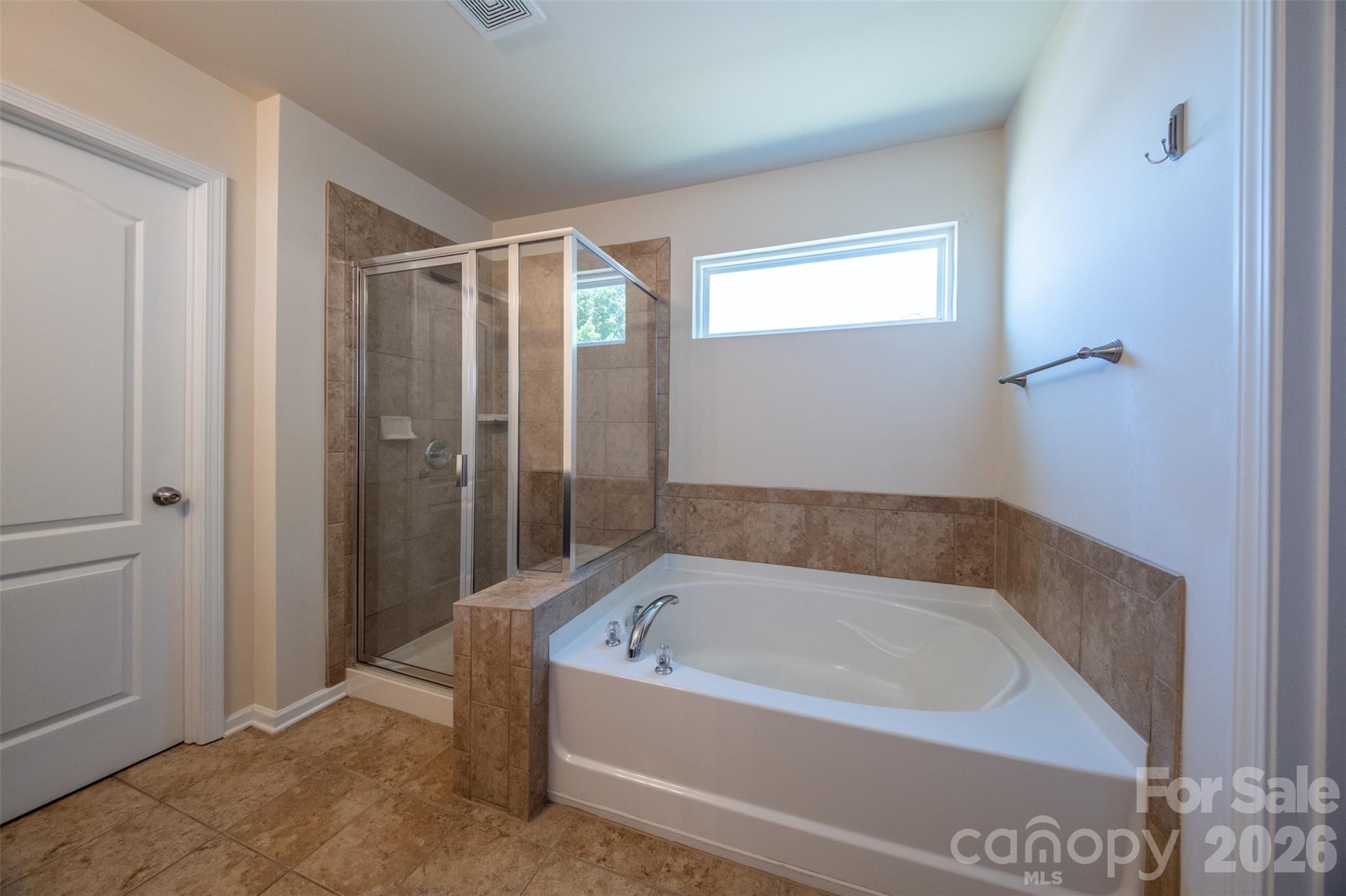 3006 Houndscroft Road Indian Trail, NC 28079 - Photo 35 of 39 a bathroom with a bathtub and shower