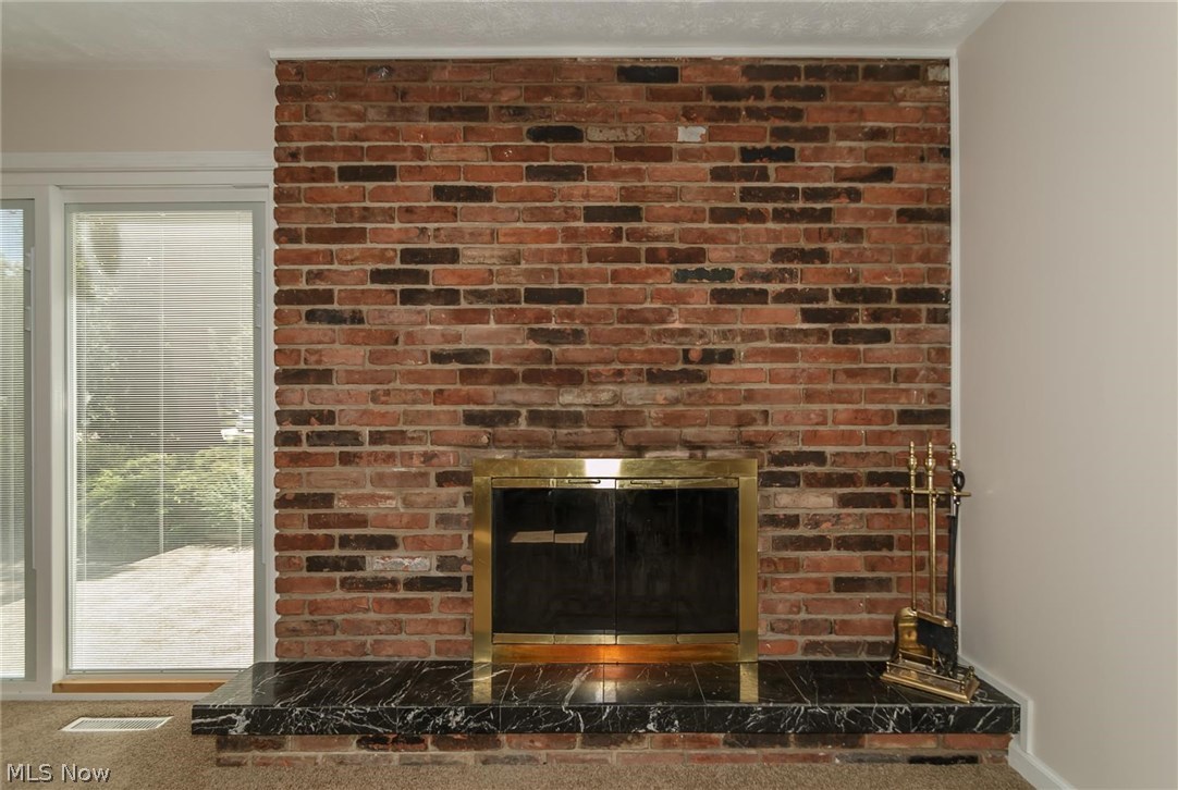 5590 Ridgebury Boulevard Lyndhurst, OH 44124 - Photo 12 of 25 Gathering room fireplace.
