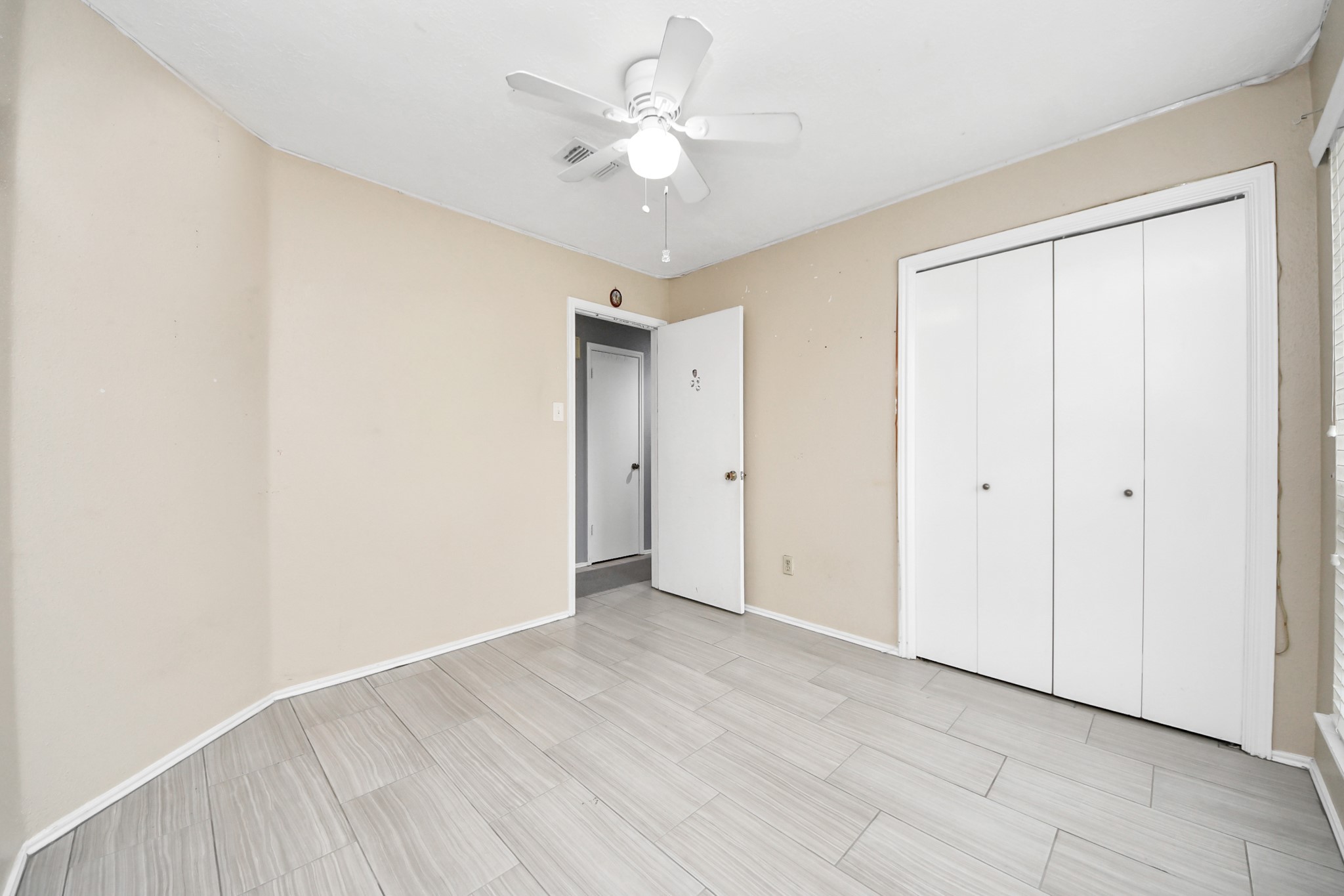 17702 Poppy Trails Lane Houston, TX 77084 - Photo 30 of 37 a view of an empty room with a ceiling fan