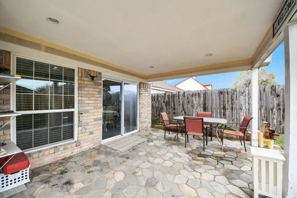 a view of a house with chairs in patio