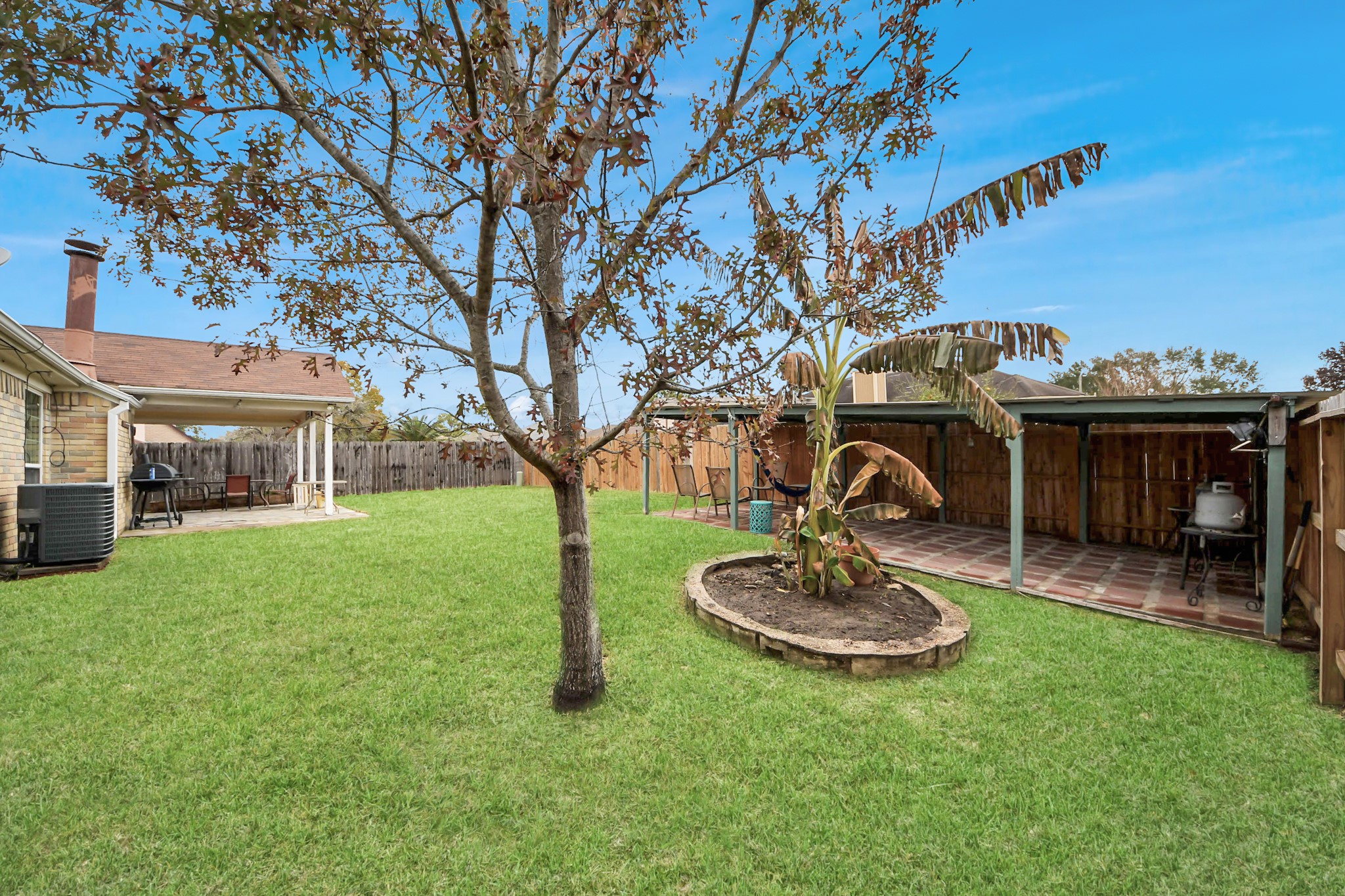 17702 Poppy Trails Lane Houston, TX 77084 - Photo 35 of 37 a view of a house with backyard and a tree
