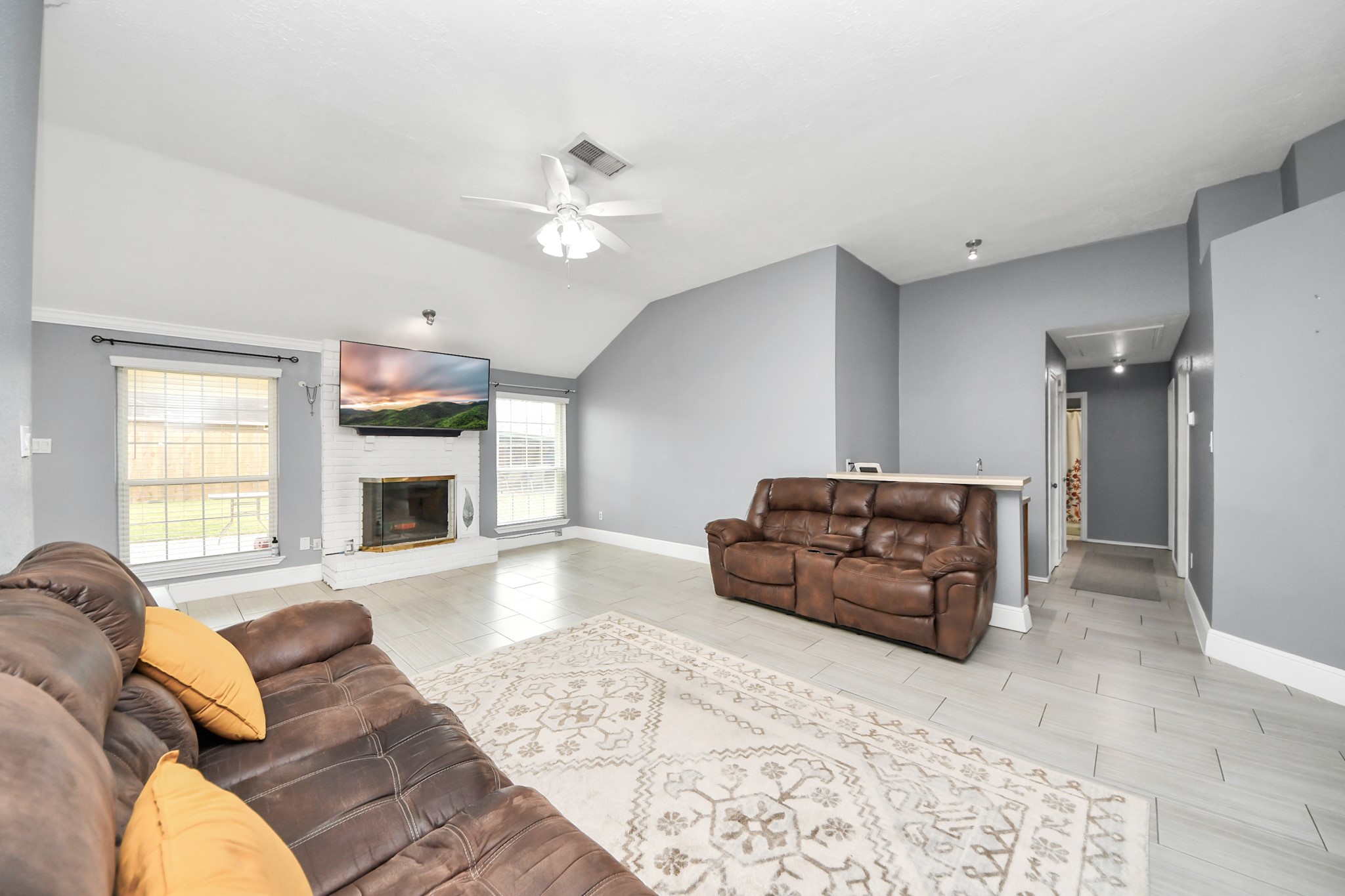 17702 Poppy Trails Lane Houston, TX 77084 - Photo 8 of 37 a living room with furniture and a fireplace