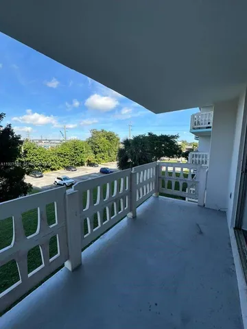 a view of a balcony with city