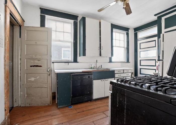 1156 Pemberton Street Pittsburgh, PA 15212 - Photo 11 of 20 a kitchen with stainless steel appliances a sink stove and cabinets