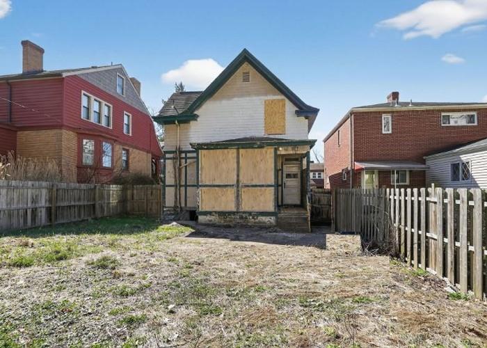 1156 Pemberton Street Pittsburgh, PA 15212 - Photo 3 of 20 a front view of a house with a yard