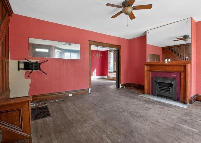 1156 Pemberton Street Pittsburgh, PA 15212 - Photo 8 of 20 a view of an empty room with a fireplace