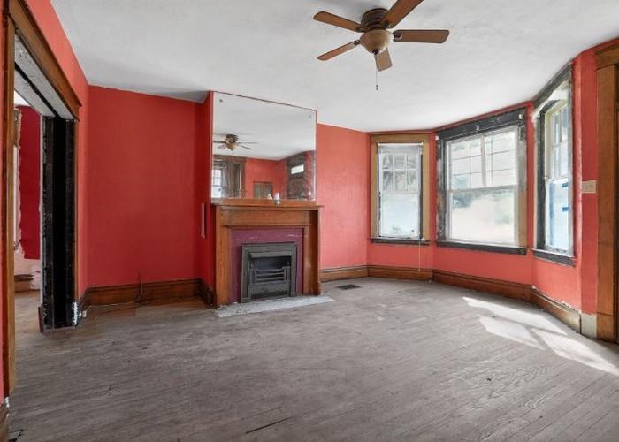 1156 Pemberton Street Pittsburgh, PA 15212 - Photo 10 of 20 a view of empty room with fireplace and fan