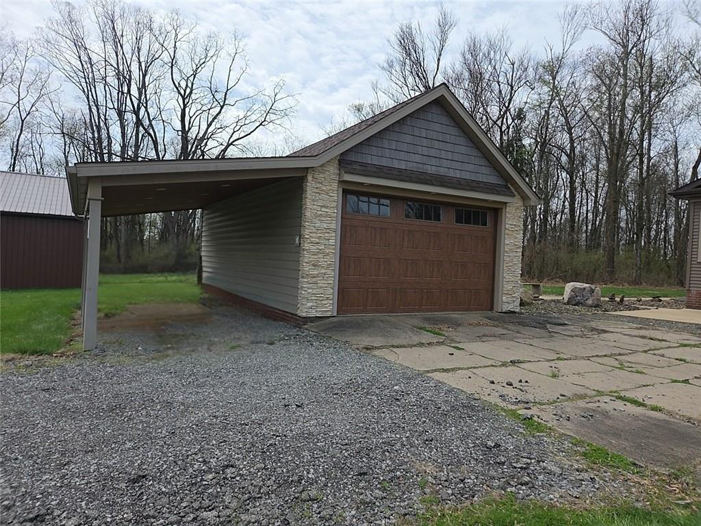 460 Beaver Run Road Apollo, PA 15613 - Photo 35 of 47 a front view of a house with a yard and garage