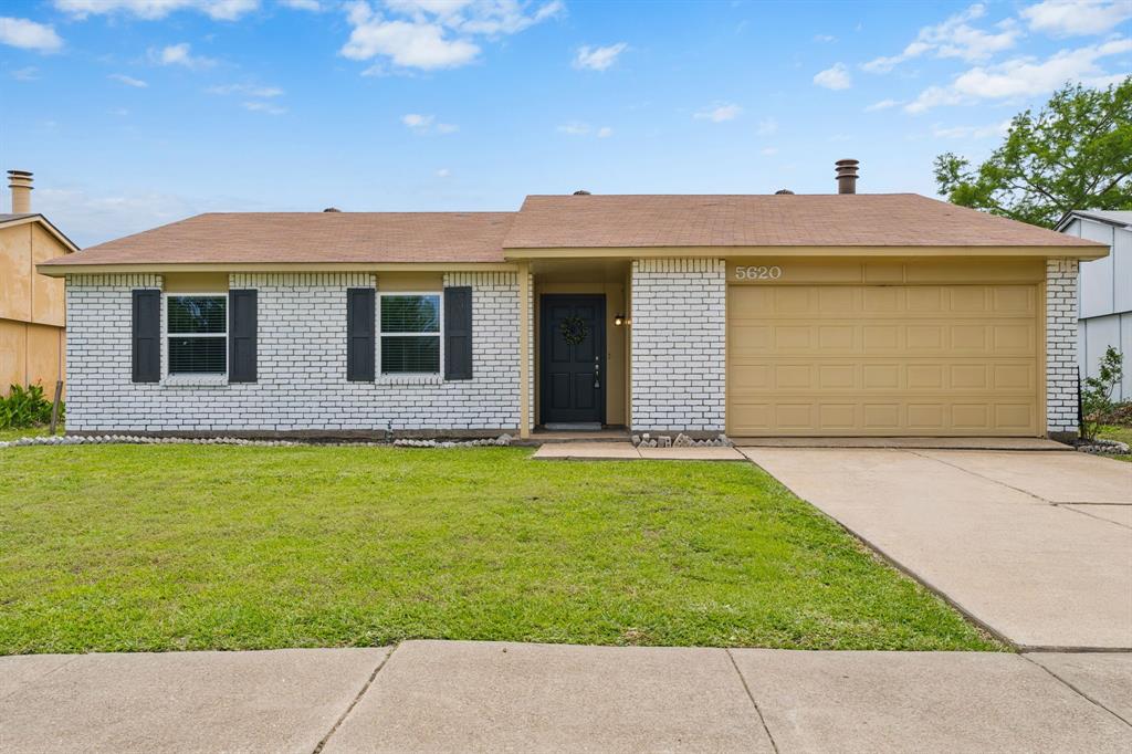 5620 Perrin Street The Colony, TX 75056 - Photo 1 of 31 a front view of a house with garden