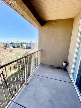 a view of balcony with furniture