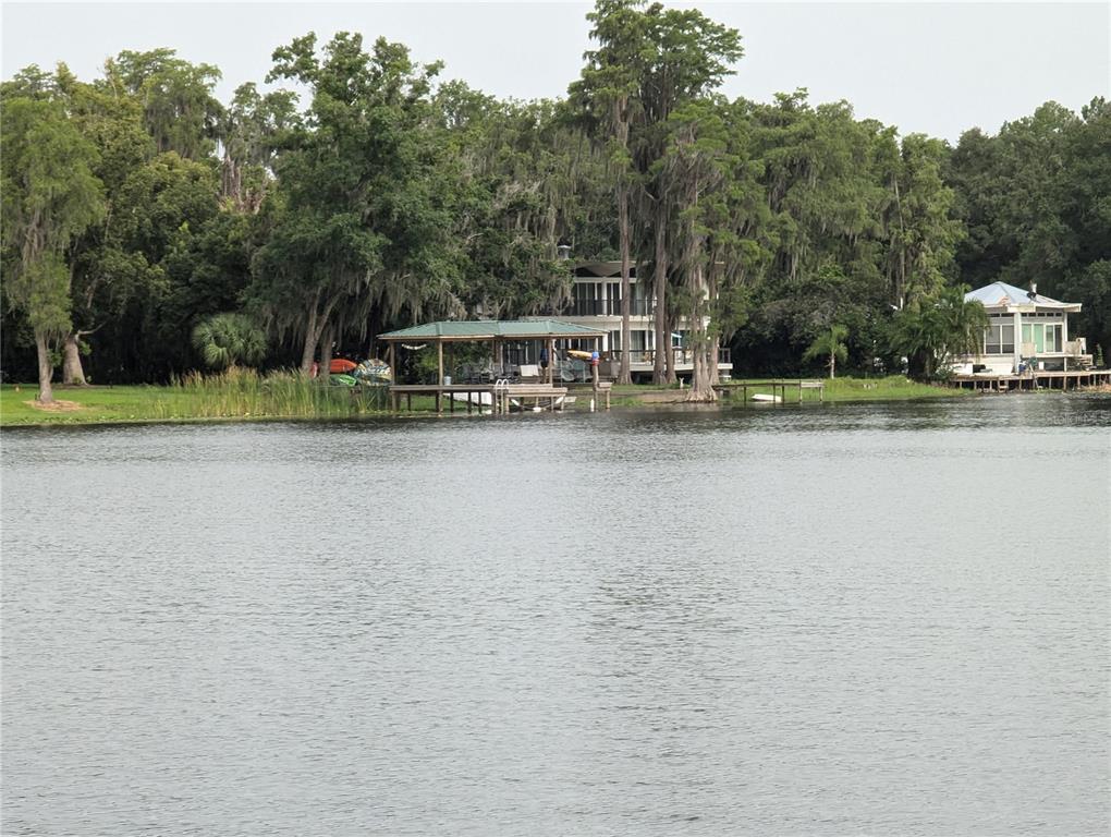 18302 Hanna Road Lutz, FL 33549 - Photo 16 of 58 a view of a lake with houses