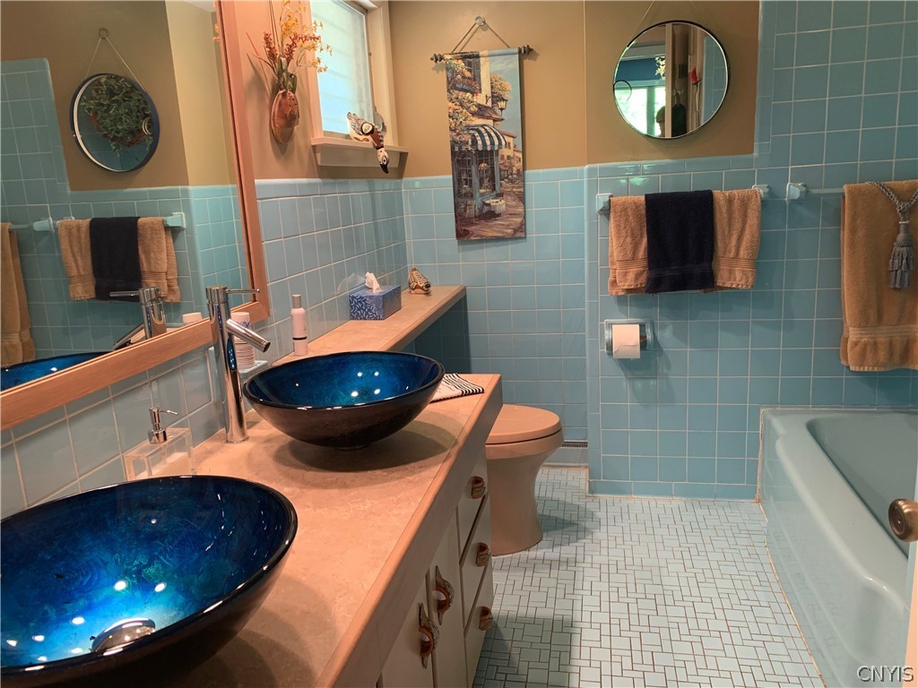 206 Deforest Road Syracuse, NY 13214 - Photo 19 of 49 Main Bathroom with double blue glass sinks