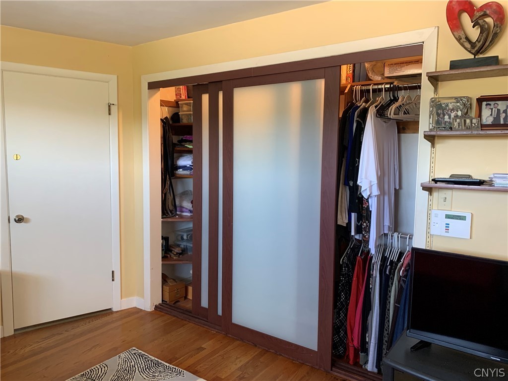 206 Deforest Road Syracuse, NY 13214 - Photo 21 of 49 Sliding glass panels close in the closet with orga