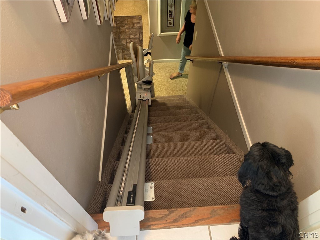 206 Deforest Road Syracuse, NY 13214 - Photo 23 of 49 Chair lift from the first floor to the lower level