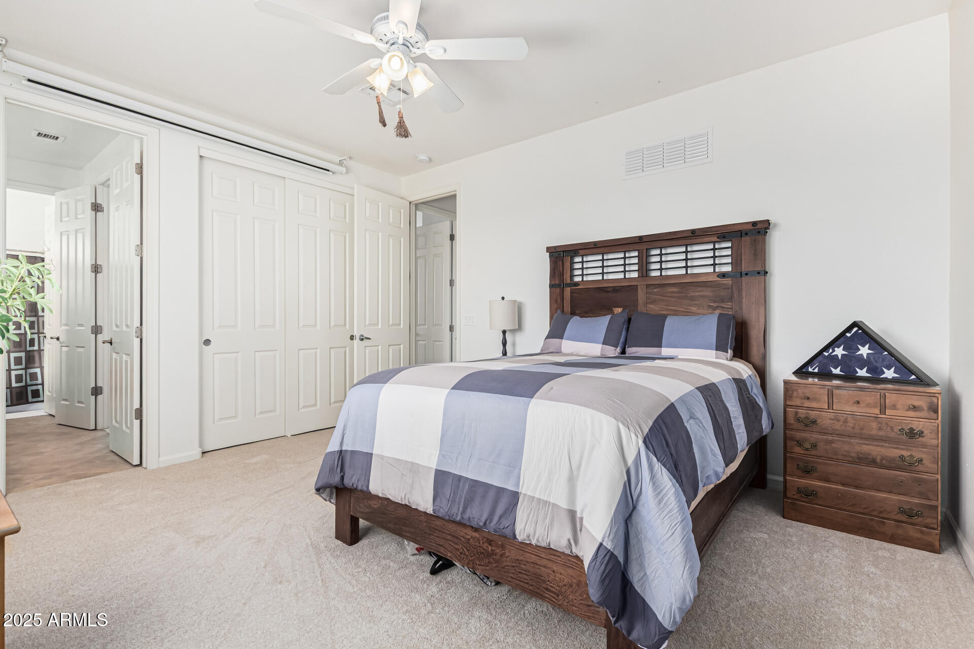 246 East Frances Lane Gilbert, AZ 85295 - Photo 16 of 25 a spacious bedroom with a bed and a dresser
