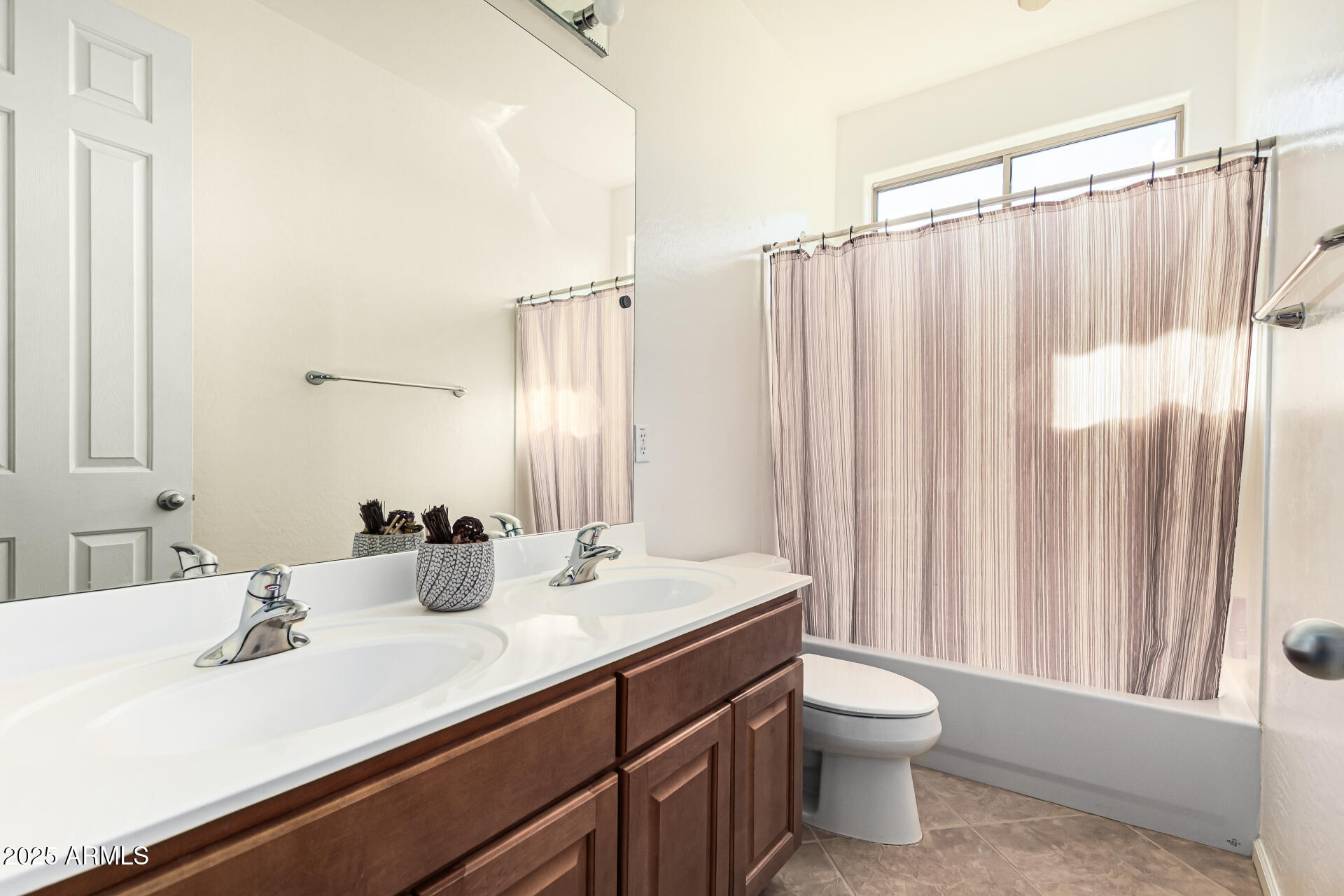 246 East Frances Lane Gilbert, AZ 85295 - Photo 19 of 25 a bathroom with a double vanity sink toilet and a mirror