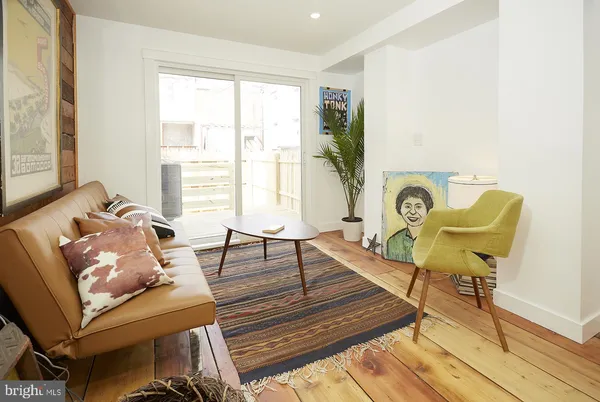 a living room with furniture and a table
