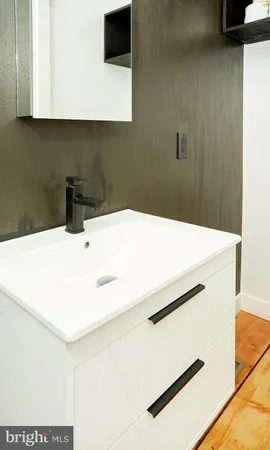 a kitchen with a sink and a stove