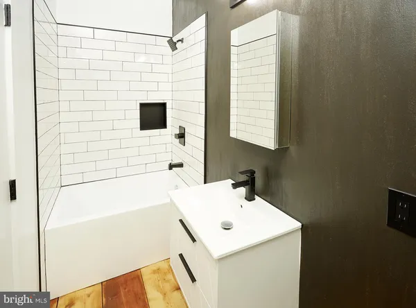 a bathroom with a sink and a shower