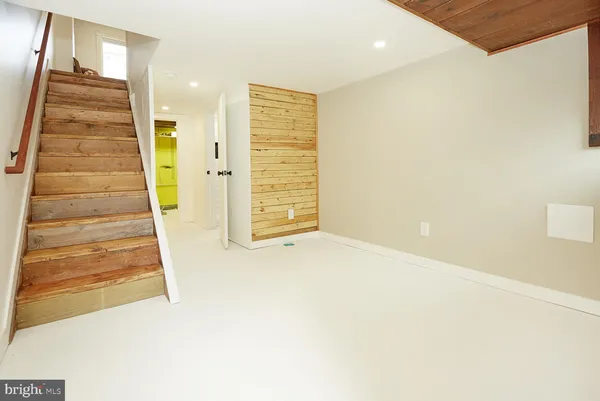 a view of an empty room with stairs