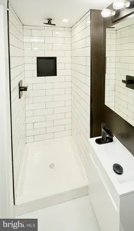 a bathroom with a sink and a shower