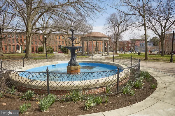 a view of a water fountain in front of a house