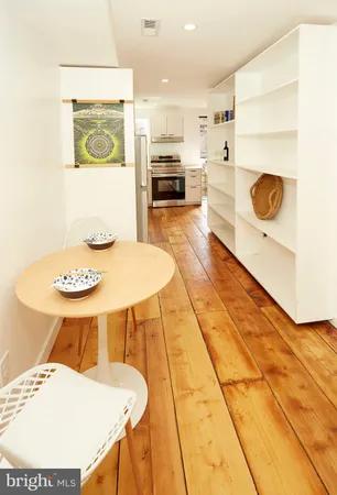 a kitchen with a table and chairs in it