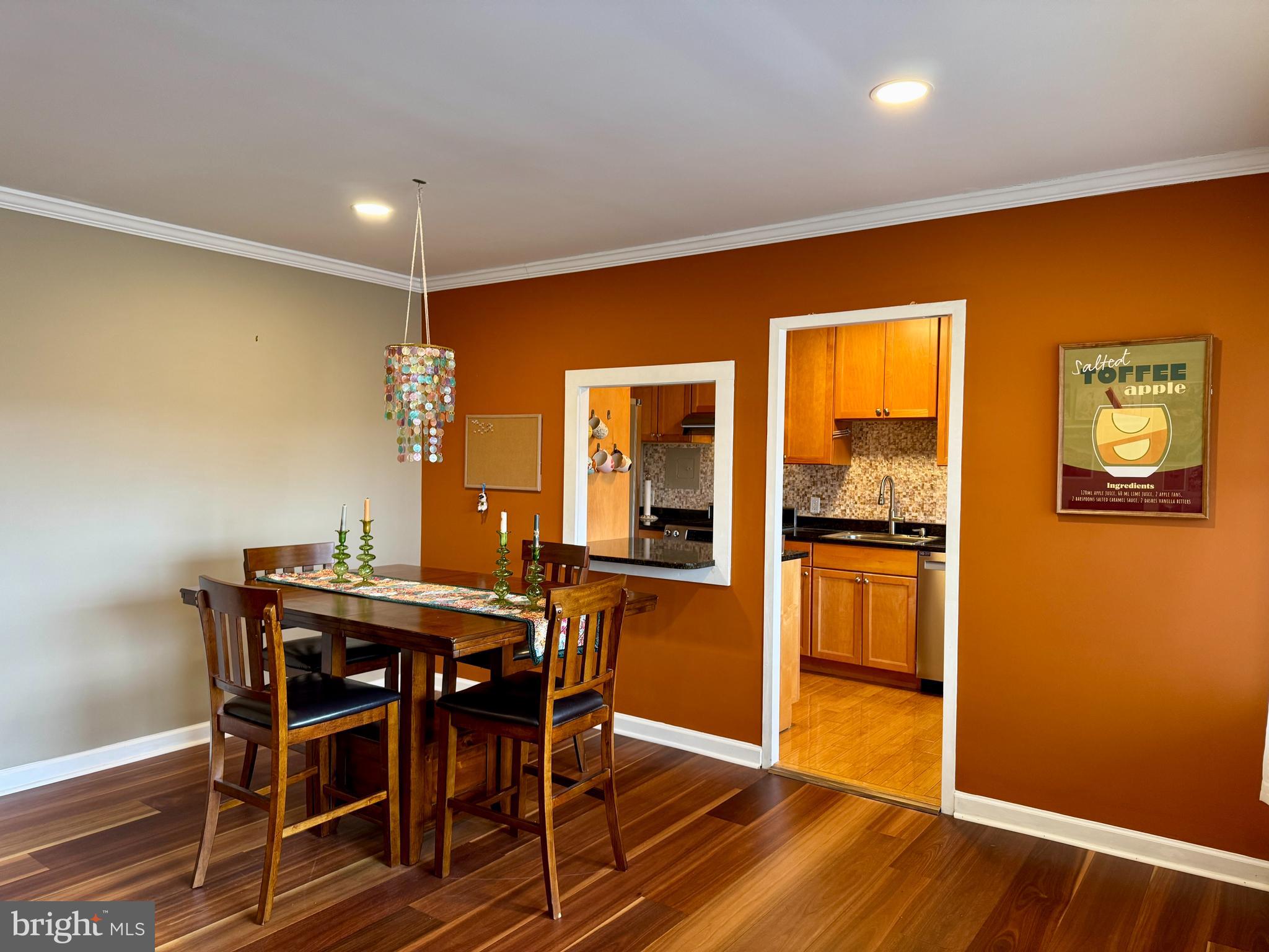 7900 Old York Road, Unit 814A Elkins Park, PA 19027 - Photo 13 of 43 a view of a dining room with furniture and wooden floor