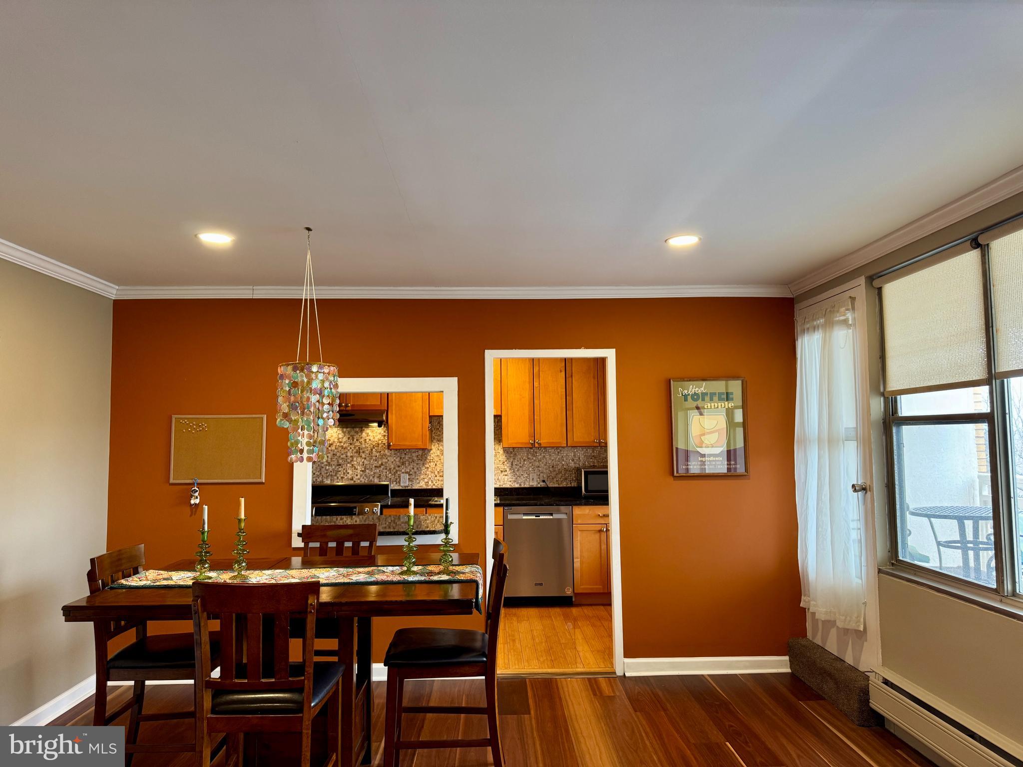 7900 Old York Road, Unit 814A Elkins Park, PA 19027 - Photo 14 of 43 a view of a dining room with furniture window and wooden floor