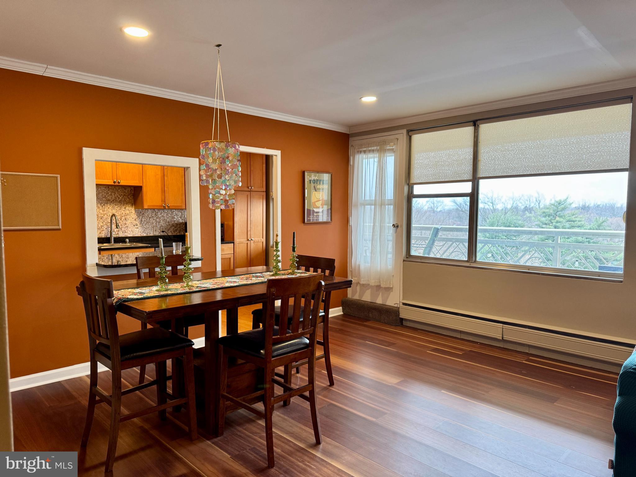 7900 Old York Road, Unit 814A Elkins Park, PA 19027 - Photo 16 of 43 a dining room with furniture a chandelier and wooden floor