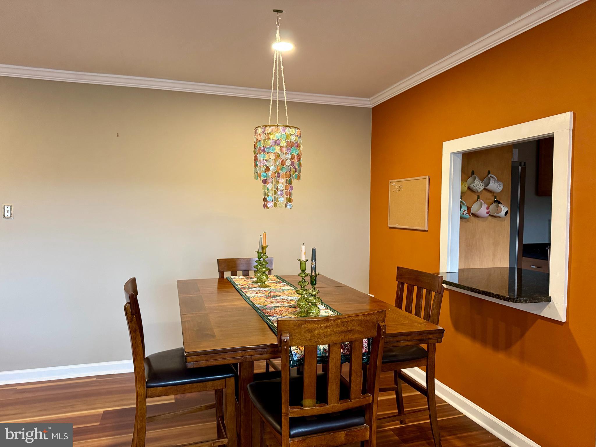 7900 Old York Road, Unit 814A Elkins Park, PA 19027 - Photo 17 of 43 a view of a dining room with furniture and wooden floor
