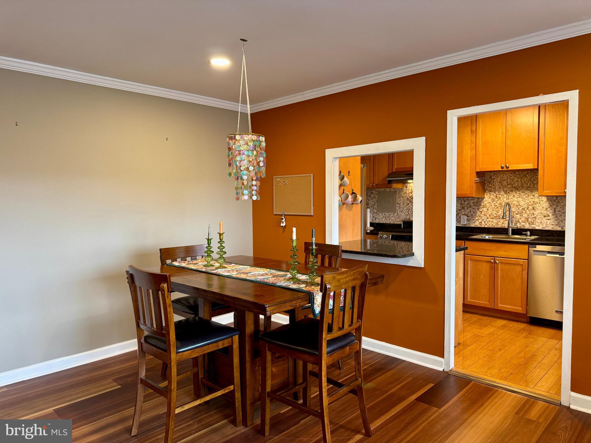 7900 Old York Road, Unit 814A Elkins Park, PA 19027 - Photo 18 of 43 a view of a dining room with furniture window and wooden floor