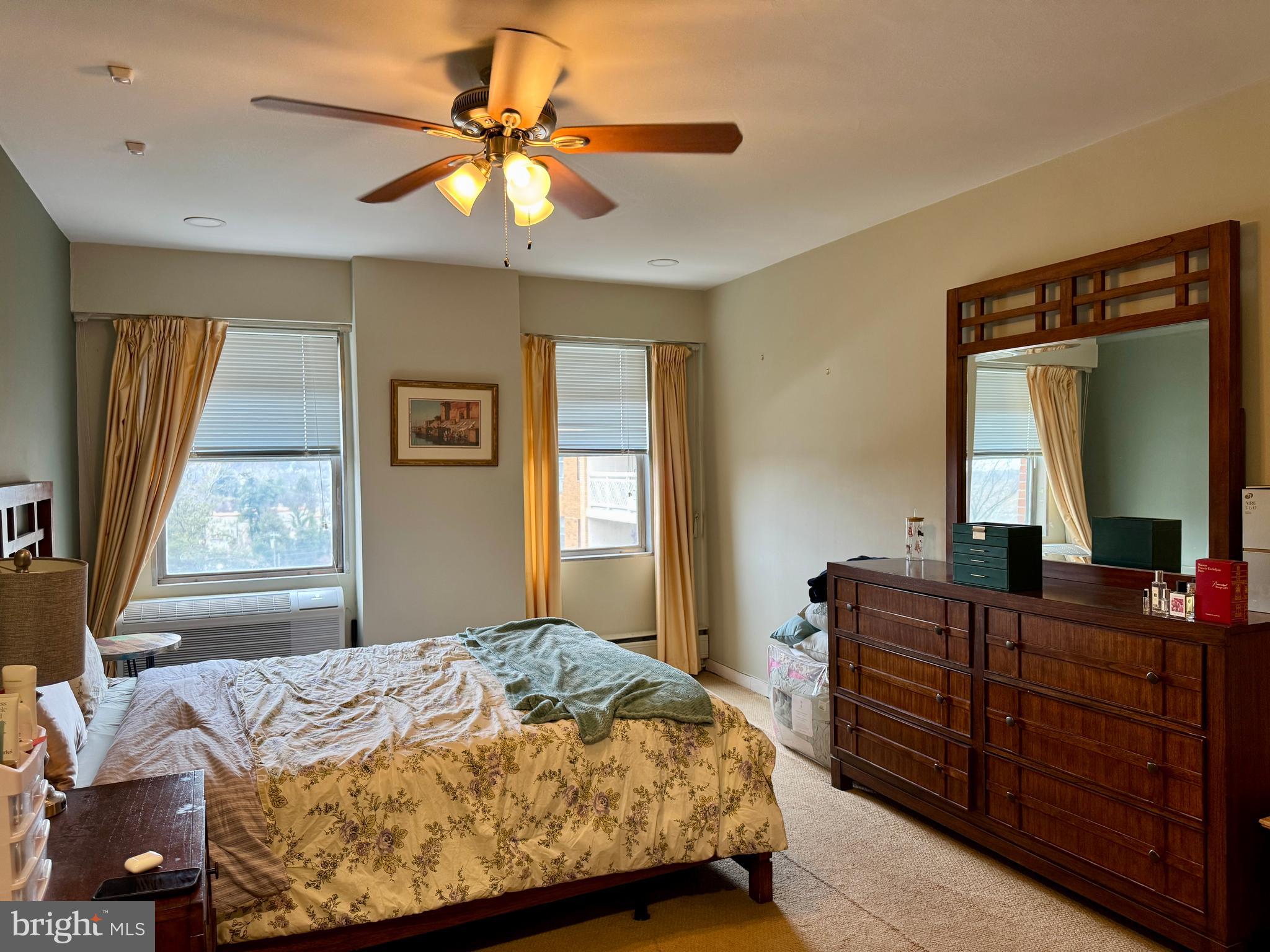 7900 Old York Road, Unit 814A Elkins Park, PA 19027 - Photo 29 of 43 a bedroom with a bed dresser and a window