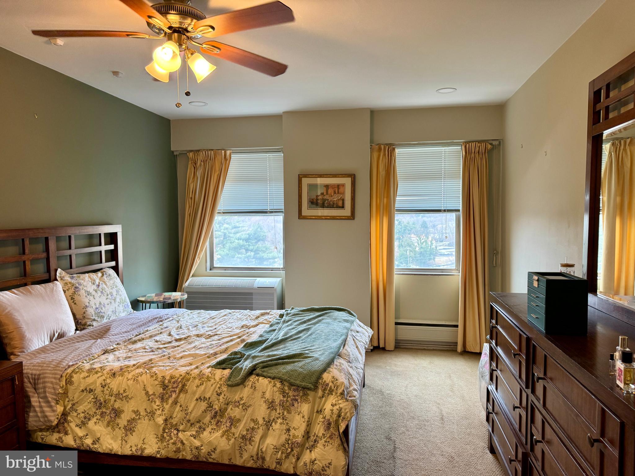 7900 Old York Road, Unit 814A Elkins Park, PA 19027 - Photo 32 of 43 a bedroom with a bed and a flat tv screen on dresser