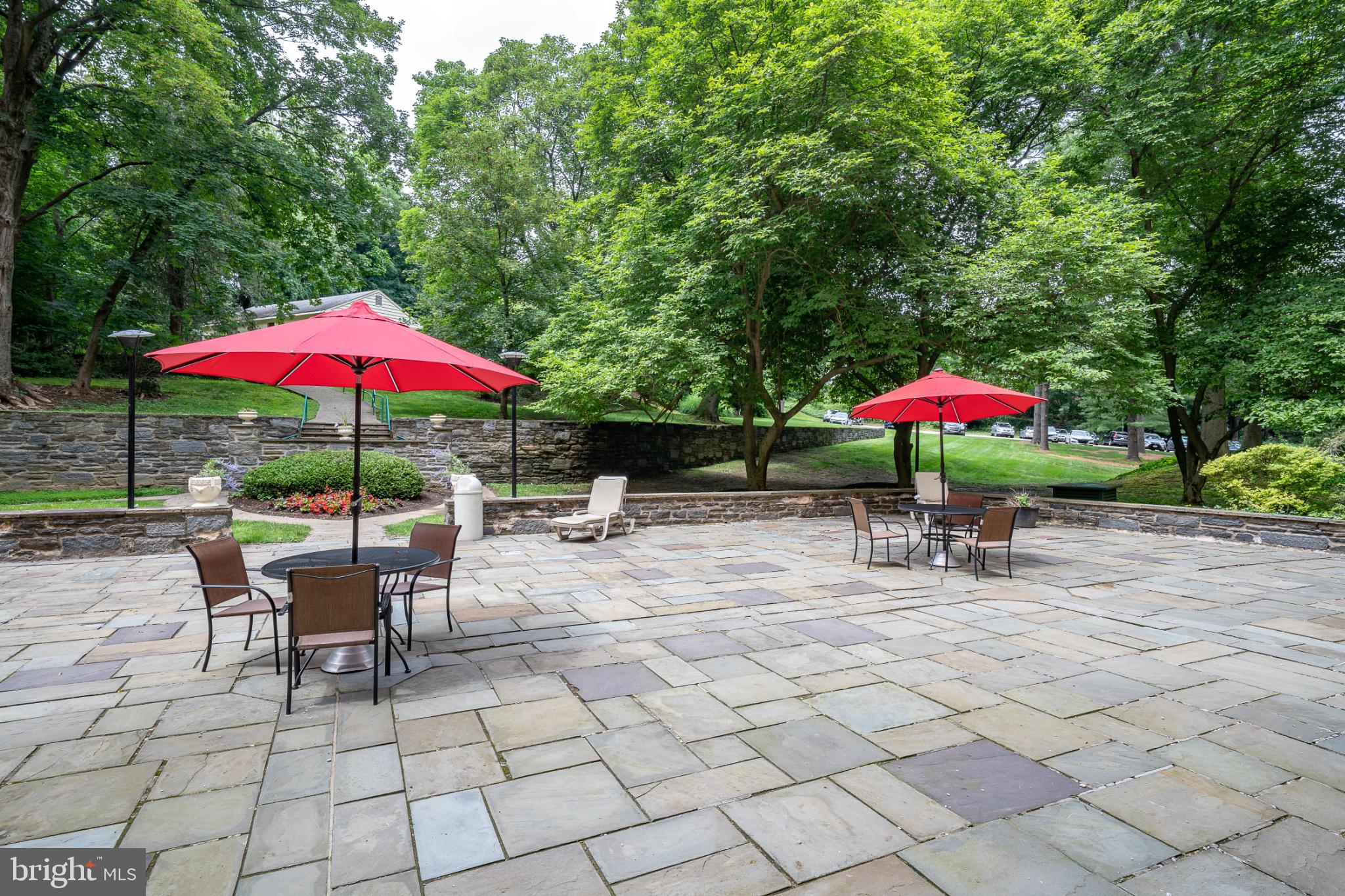 7900 Old York Road, Unit 814A Elkins Park, PA 19027 - Photo 37 of 43 a view of a backyard with a patio and garden