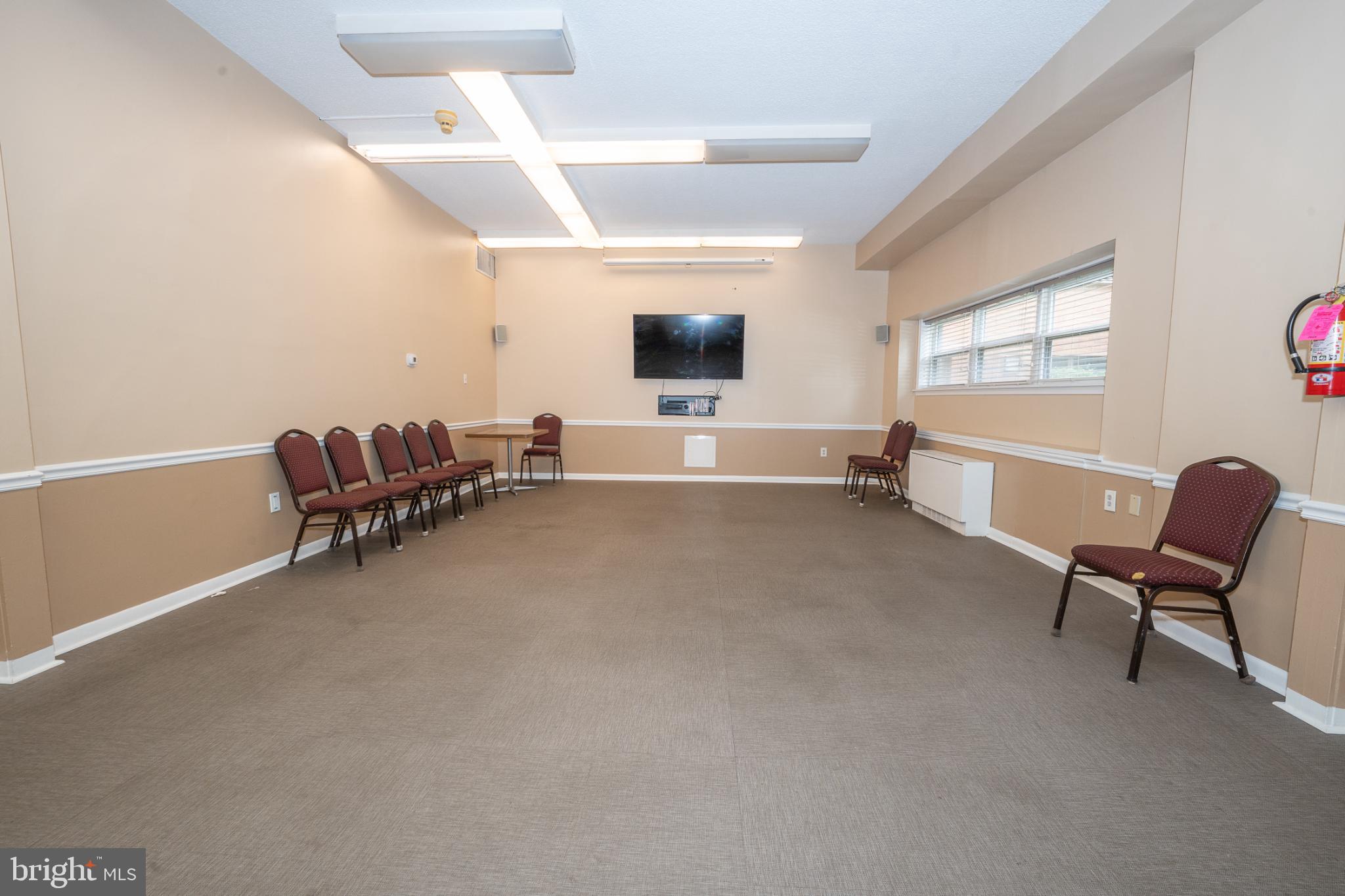 7900 Old York Road, Unit 814A Elkins Park, PA 19027 - Photo 38 of 43 a living room with furniture and a flat screen tv